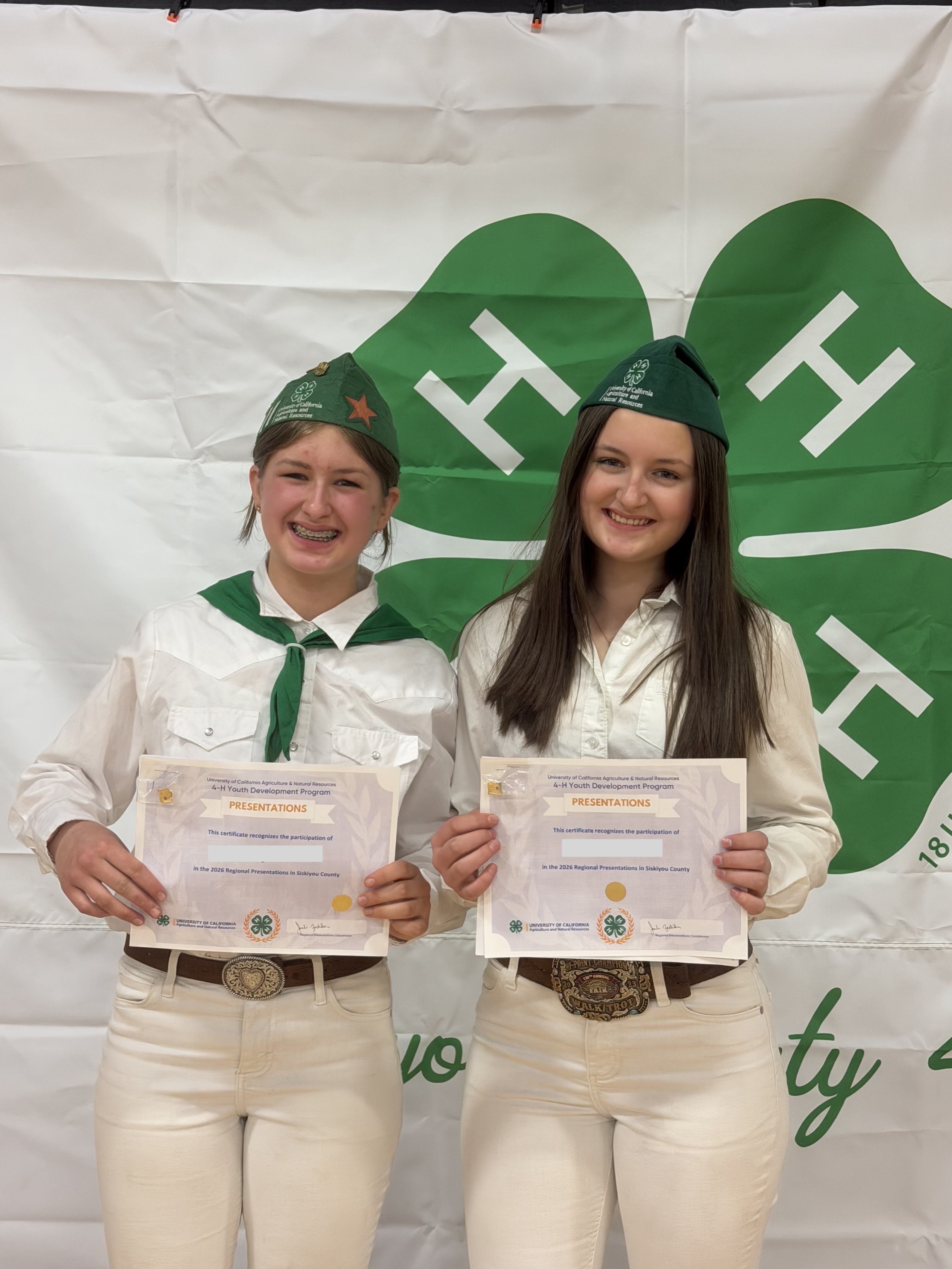 Students holding certificates